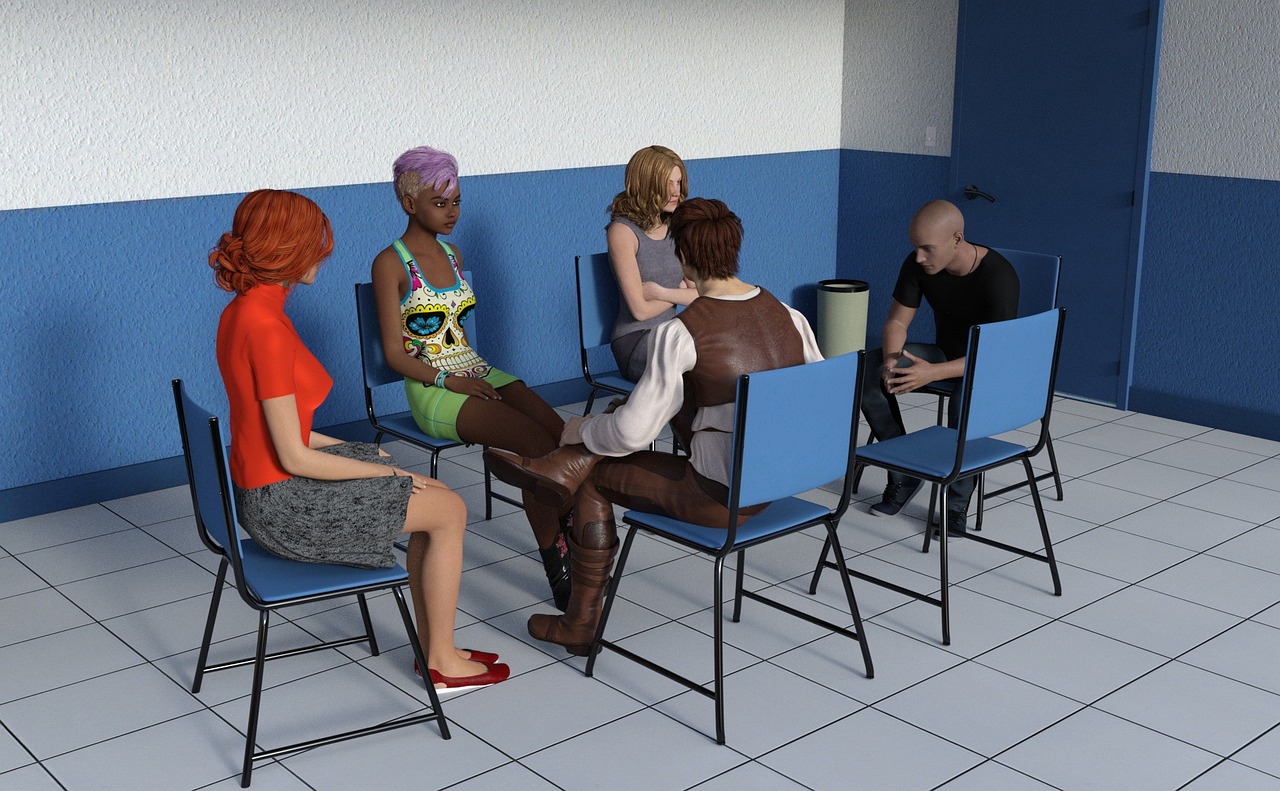 Grupo de pessoas reunido em círculo, conversando e trocando ideias em um encontro de apoio e cuidado coletivo